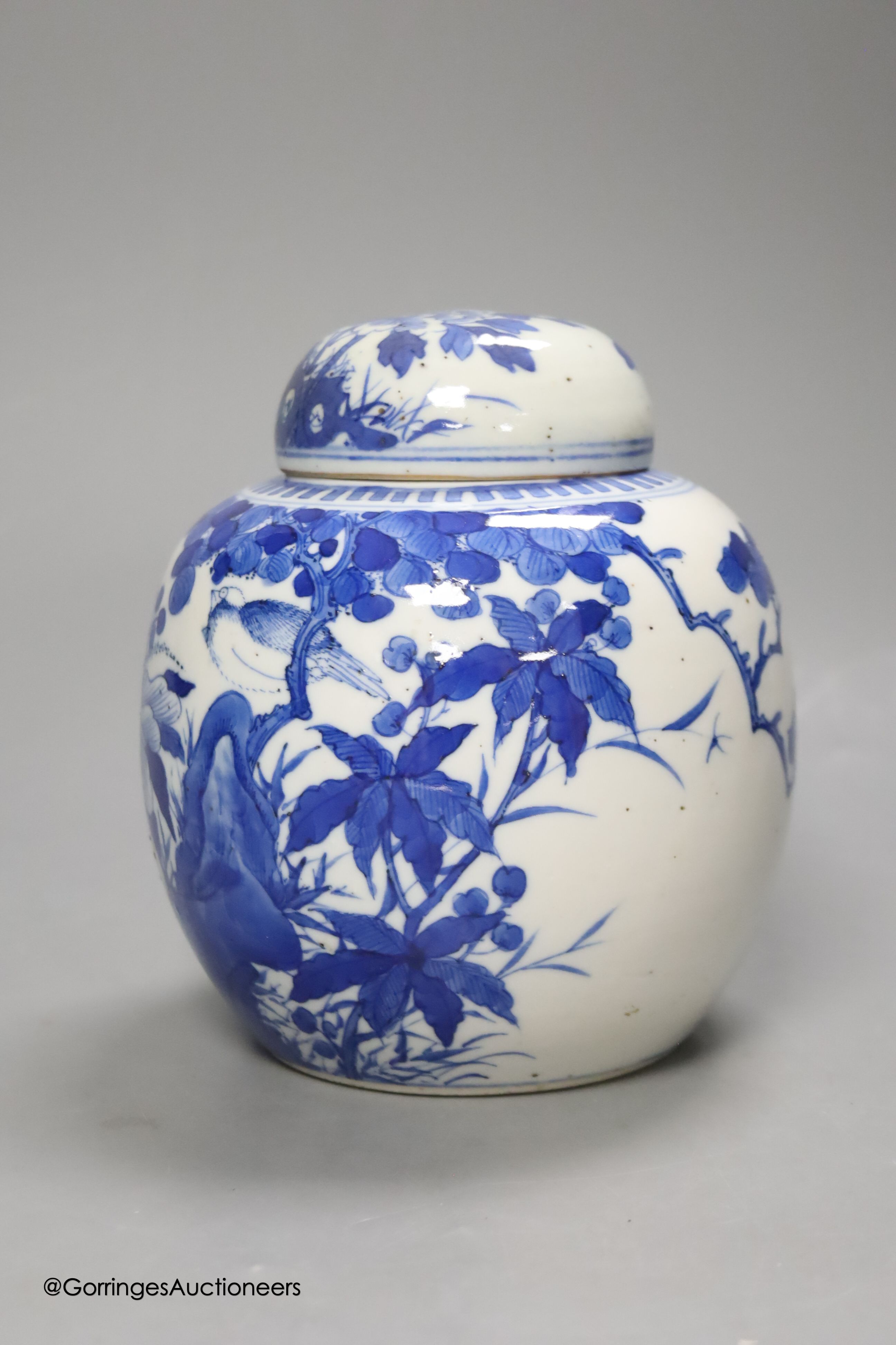 A Chinese blue and white 'birds and flowers' jar and cover, Kangxi mark, c.1900, height 15cm